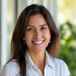 Photo of Dr. Anya Sharma, Head of Wellness Programs at VitaSprout Gardens